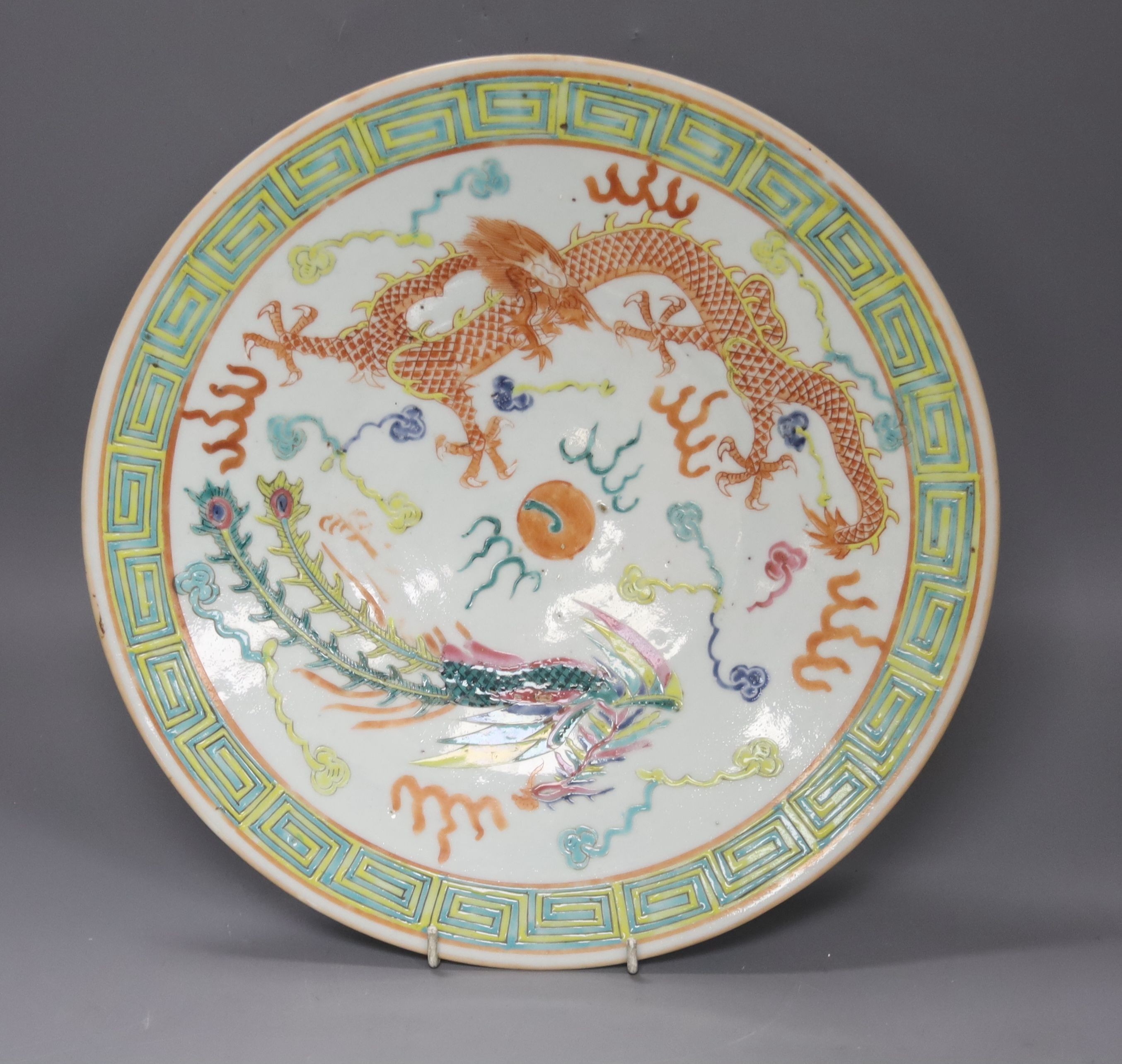 A Chinese famille rose 'dragon & phoenix' dish, late 19th/early 20th century 34cm